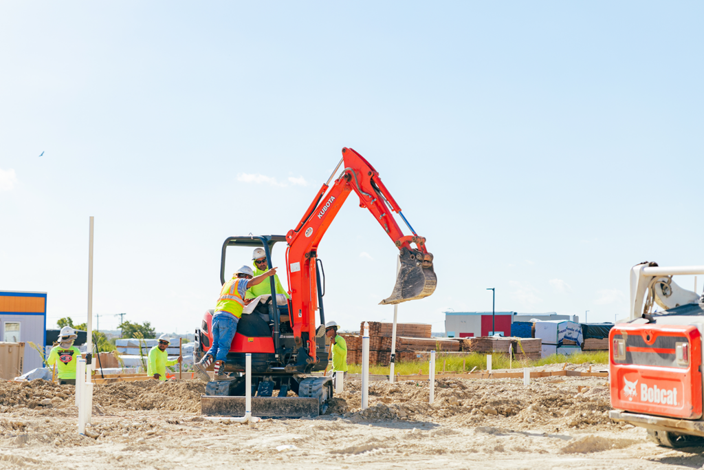 Construction workers discussing their work